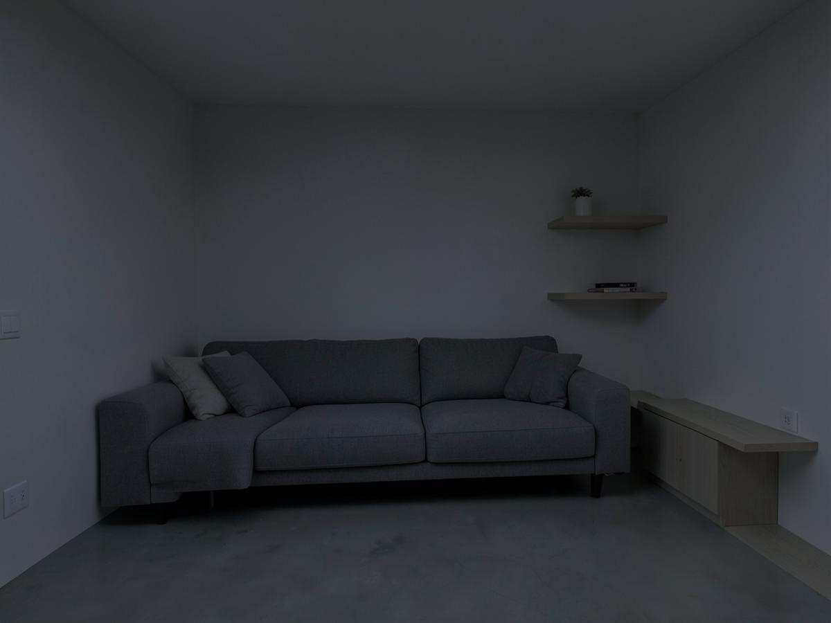 Living room with flat, dull overhead lighting